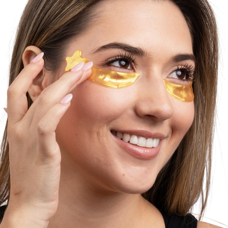 Woman applying hydrogel eye patches