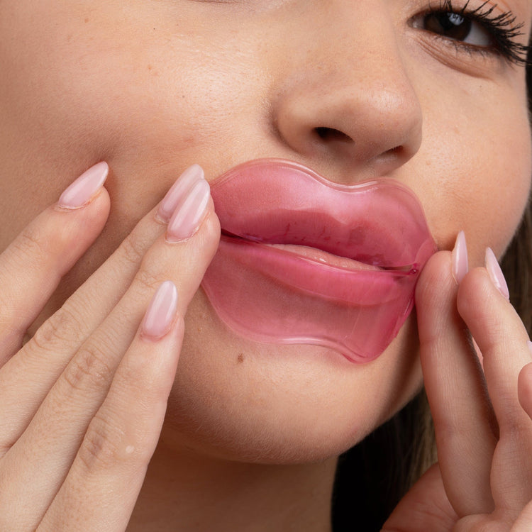 Hydrogel lip mask model applying Lush Lips product.