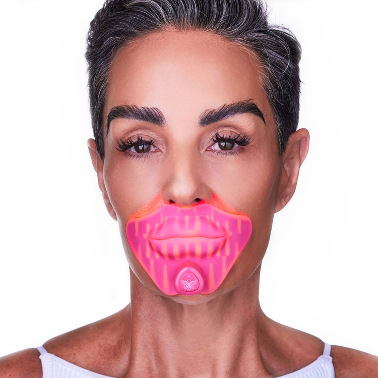 Woman wearing pink lip enhancer