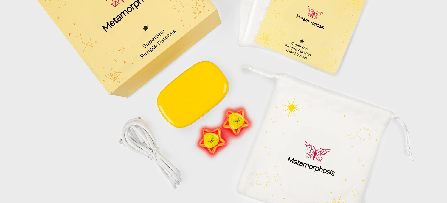 Metamorphosis Starry Pimple Patches kit including two glowing star-shaped LED acne treatment devices, a yellow portable charging case, and a white drawstring travel pouch.