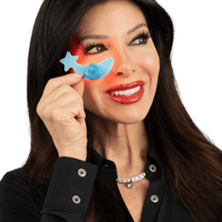Woman demonstrating the application of the Metamorphosis periorbital LED eye device for fine lines.