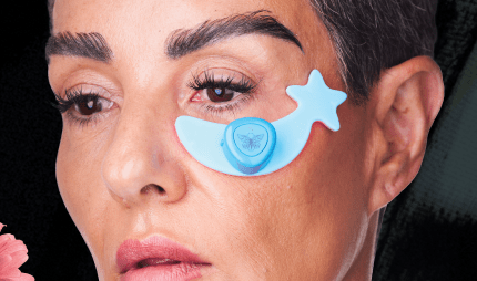 Metamorphosis Magic Moon Eye Evolution, a blue, star-shaped LED light therapy device applied under the eye to reduce wrinkles, puffiness, and dark circles.
