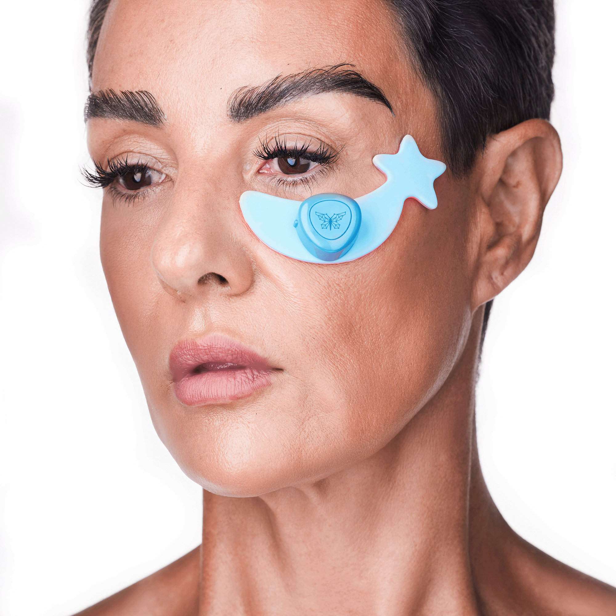 Woman wearing a single Metamorphosis moon-shaped periorbital LED eye device for fine lines and skin smoothing.