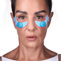 Portrait of a woman using the Metamorphosis at-home periorbital wrinkle treatment with dual glowing LED moons.
