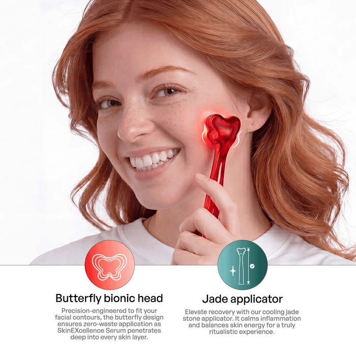 Redheaded woman using the Metamorphosis heart-shaped LED facial massager with a butterfly bionic head and cooling jade applicator for serum penetration.