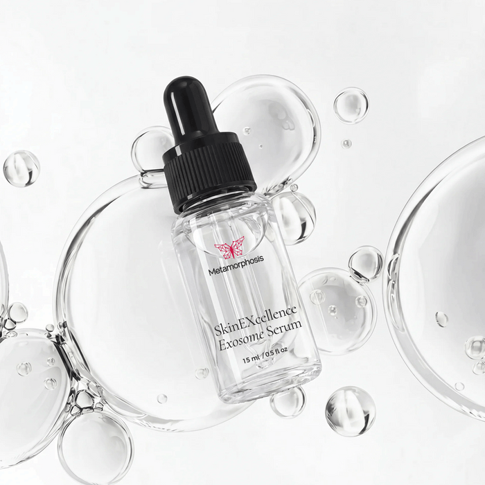 Metamorphosis SkinEXcellence Exosome Serum 15ml dropper bottle displayed flat-lay on a clean white background with clear, floating liquid serum bubbles.