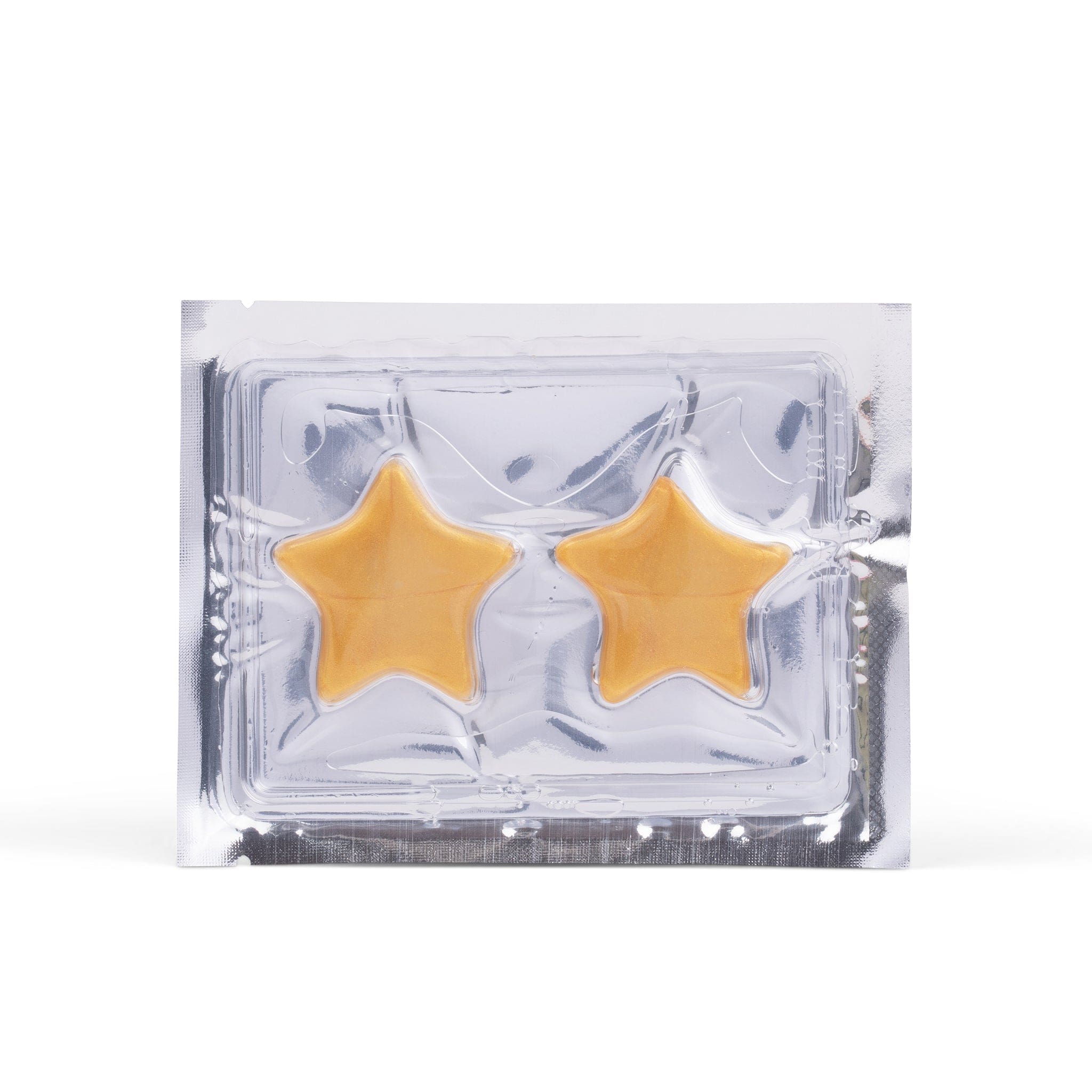 A silver foil single-use sachet containing two gold, star-shaped Metamorphosis hydrogel eye masks or pimple patches, designed for under-eye hydration and skin treatment.