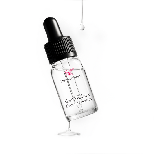 A studio product shot of the clear bottle of Metamorphosis SkinEXcellence Exosome Serum with a dropper, and a single drop falling from above, an advanced formula designed to boost collagen and enhance skin repair.