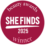 Circular badge with 'She Finds' 2025 Winner